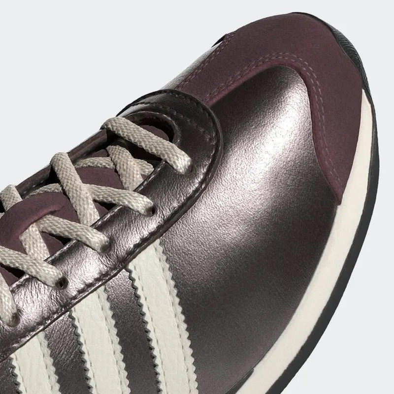 
                      
                        Zapatilla Country OG W
                      
                    